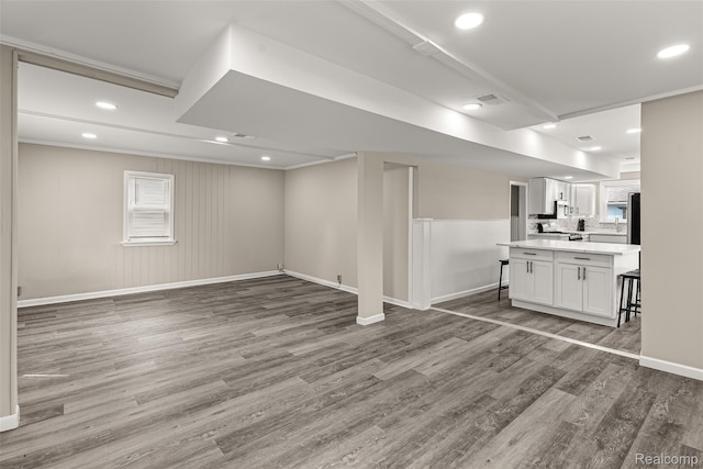 8329 Lenore St, Dearborn Heights, MI 48127 - unfurnished living room with wood finished floors and recessed lighting