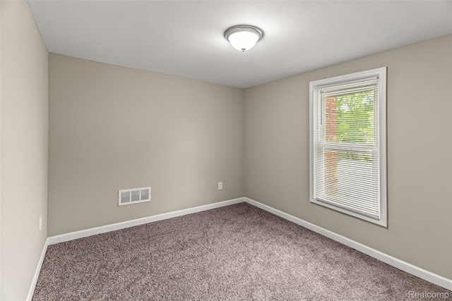 8329 Lenore St, Dearborn Heights, MI 48127 - carpeted spare room featuring baseboards