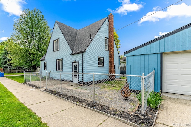 8329 Lenore St, Dearborn Heights, MI 48127 - view of home's exterior with a shingled roof and a chimney