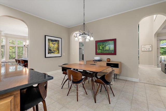 4608 Old Grand River Trl NE, Ada, MI 49301 - dining space with arched walkways, a chandelier, light tile patterned floors, crown molding, and light colored carpet