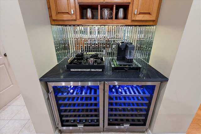 4608 Old Grand River Trl NE, Ada, MI 49301 - bar area with wine cooler and tile patterned flooring