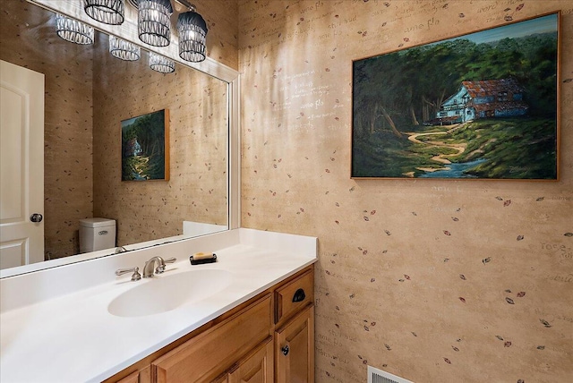 4608 Old Grand River Trl NE, Ada, MI 49301 - half bath featuring vanity and a chandelier