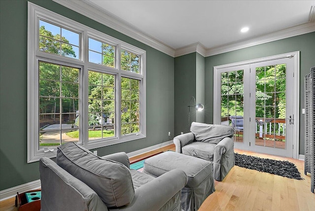 4608 Old Grand River Trl NE, Ada, MI 49301 - living room featuring healthy amount of natural light, wood finished floors, and crown molding