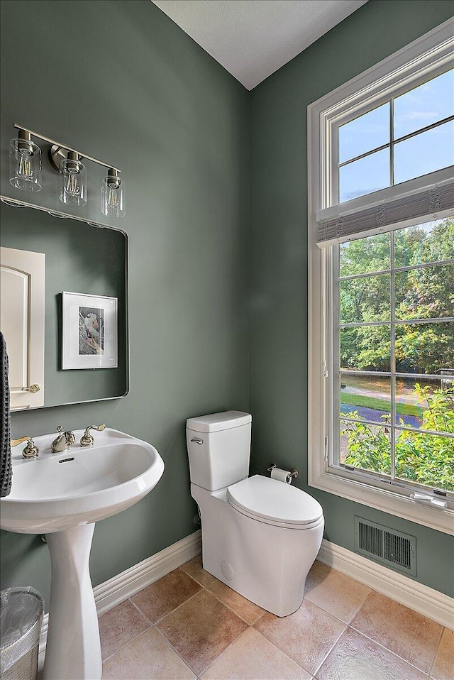 4608 Old Grand River Trl NE, Ada, MI 49301 - bathroom with baseboards and toilet