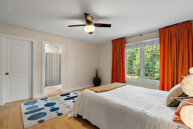 4608 Old Grand River Trl NE, Ada, MI 49301 - bedroom with wood finished floors and ceiling fan