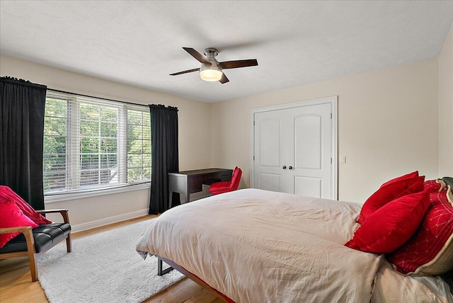 4608 Old Grand River Trl NE, Ada, MI 49301 - bedroom with wood finished floors and ceiling fan
