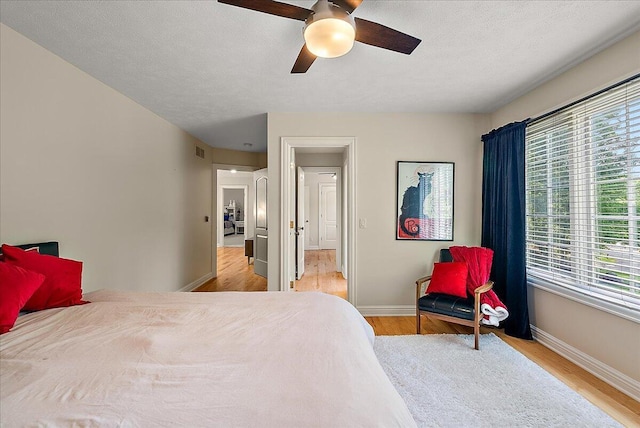 4608 Old Grand River Trl NE, Ada, MI 49301 - bedroom featuring wood finished floors and ceiling fan