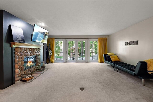 4608 Old Grand River Trl NE, Ada, MI 49301 - sitting room featuring carpet flooring and a fireplace