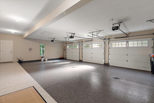 4608 Old Grand River Trl NE, Ada, MI 49301 - garage featuring a garage door opener