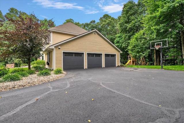 4608 Old Grand River Trl NE, Ada, MI 49301 - garage with asphalt driveway