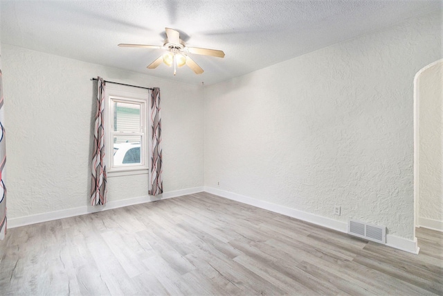 3415 Hoover St, Kalamazoo, MI 49008 - empty room featuring a textured wall, wood finished floors, ceiling fan, and a textured ceiling