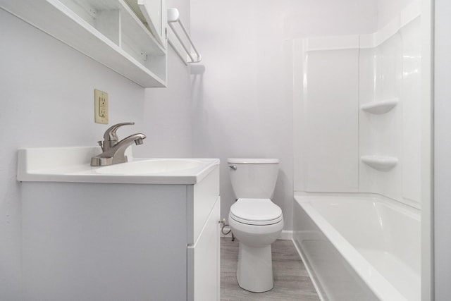 3415 Hoover St, Kalamazoo, MI 49008 - bathroom with vanity, wood finished floors, and tub / shower combination