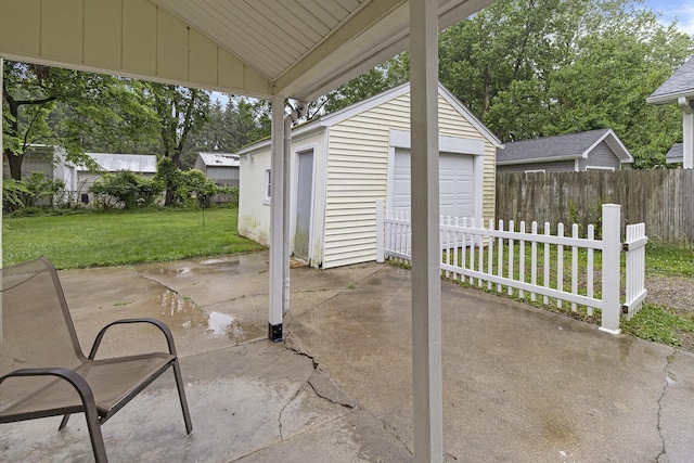 3415 Hoover St, Kalamazoo, MI 49008 - view of patio featuring a detached garage and an outdoor structure