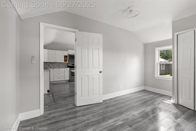 19349 Negaunee, Redford, MI 48240 - empty room featuring vaulted ceiling and dark wood finished floors