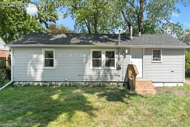 19349 Negaunee, Redford, MI 48240 - rear view of house with a lawn and a shingled roof