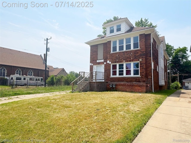 2135 Lakewood, Detroit, MI 48215 - view of front facade featuring brick siding and a front yard