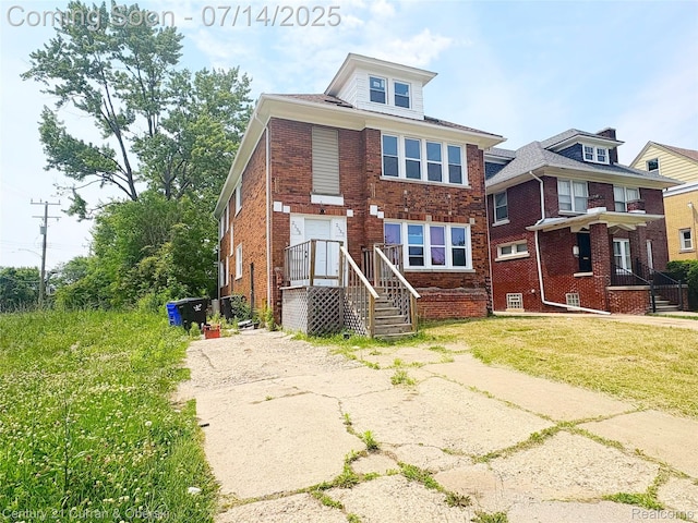 2135 Lakewood, Detroit, MI 48215 - view of front of home with brick siding and a front lawn
