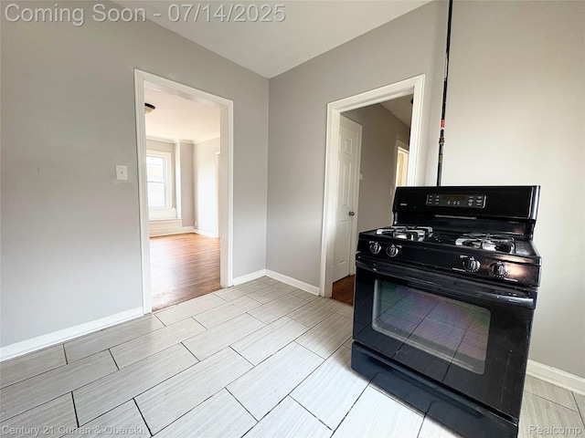 2135 Lakewood, Detroit, MI 48215 - kitchen featuring black gas range oven and wood finish floors