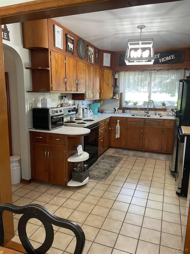 9981 W Mulberry Rd, Morenci, MI 49256 - kitchen with open shelves, electric range, light countertops, light tile patterned floors, and brown cabinets