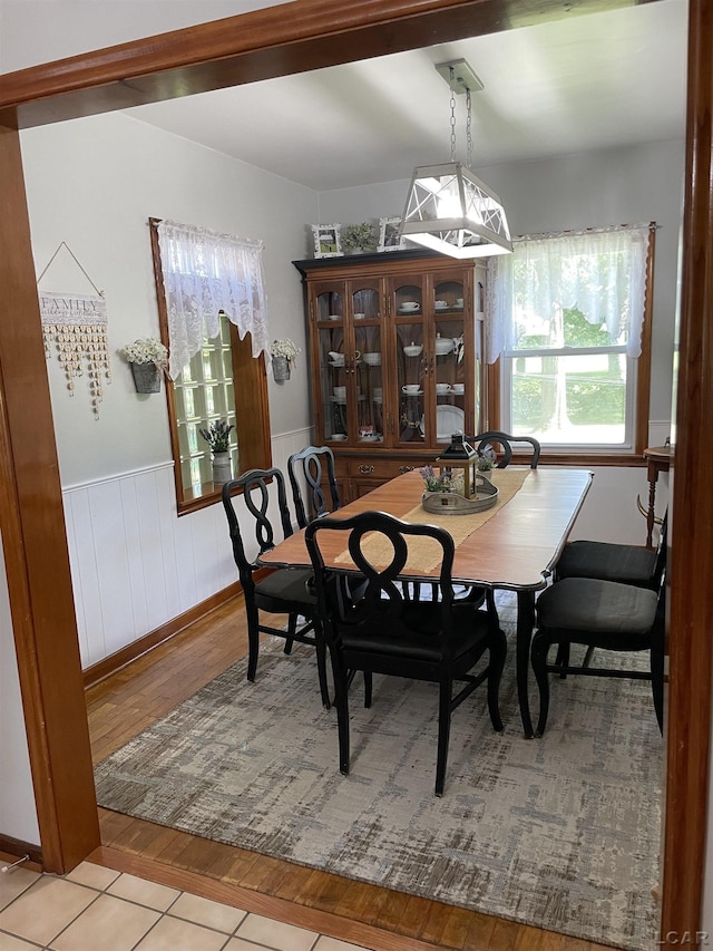 9981 W Mulberry Rd, Morenci, MI 49256 - dining room featuring light wood finished floors and a wainscoted wall