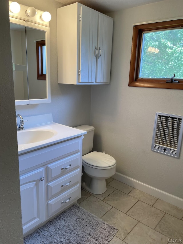 9981 W Mulberry Rd, Morenci, MI 49256 - bathroom featuring vanity, tile patterned flooring, and heating unit