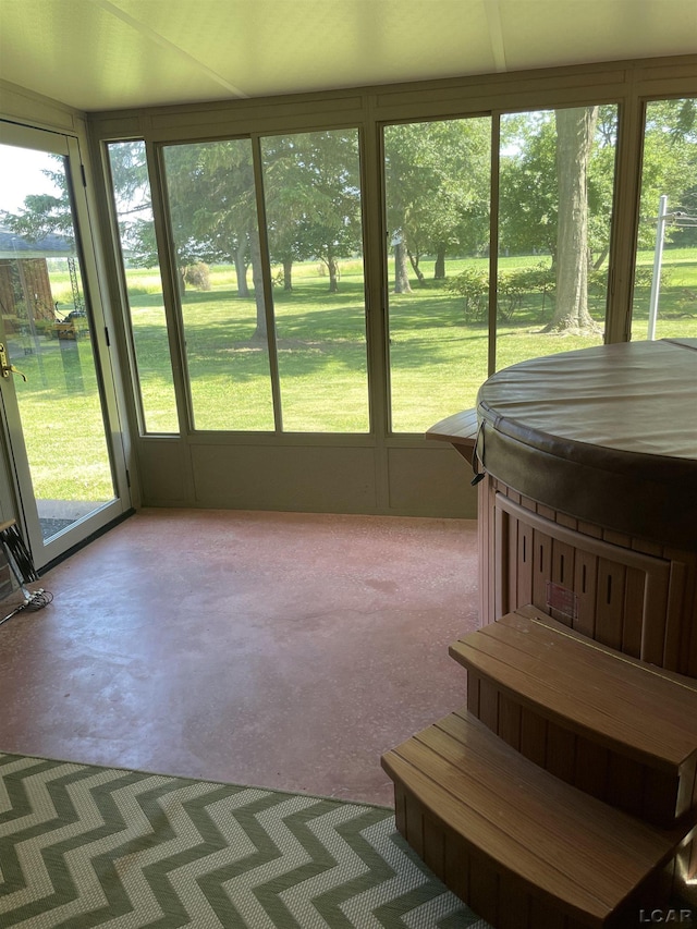 9981 W Mulberry Rd, Morenci, MI 49256 - sunroom / solarium with a jacuzzi, healthy amount of natural light, and concrete flooring