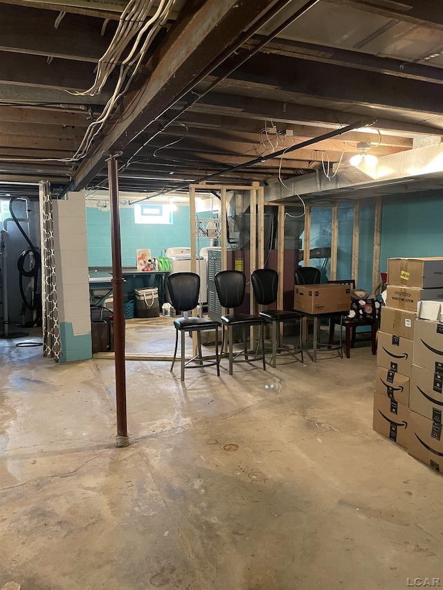 9981 W Mulberry Rd, Morenci, MI 49256 - below grade area featuring washing machine and clothes dryer