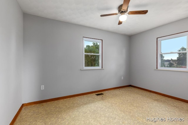 7970 Burlingame Ave SW, Byron Center, MI 49315 - empty room with ceiling fan and baseboards