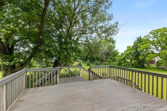 7970 Burlingame Ave SW, Byron Center, MI 49315 - wooden terrace featuring a lawn and view of scattered trees