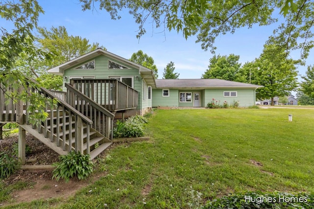 7970 Burlingame Ave SW, Byron Center, MI 49315 - back of property featuring a lawn, a deck, and stairway