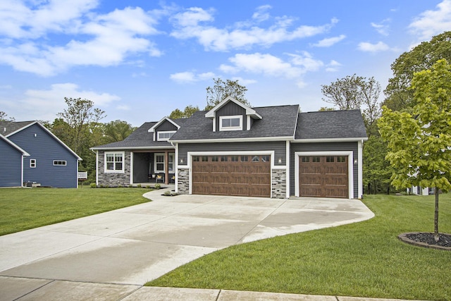 10924 Mystic Heights Trl, Michigan, MI 49071 - craftsman-style home featuring a garage, a front yard, concrete driveway, and stone siding