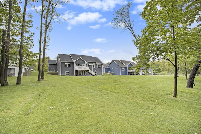 10924 Mystic Heights Trl, Michigan, MI 49071 - view of green lawn with stairs and a deck