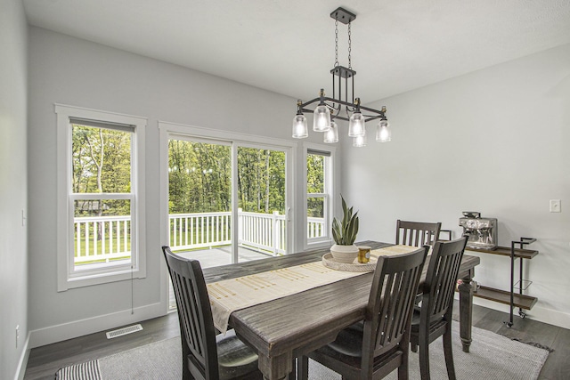 10924 Mystic Heights Trl, Michigan, MI 49071 - dining area featuring baseboards and wood finished floors