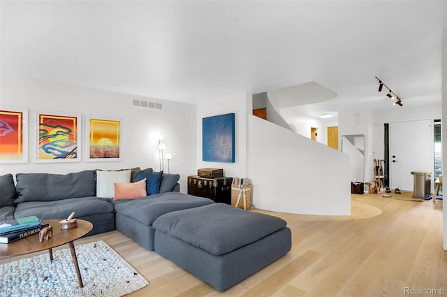 30715 River Crossing St, Bingham Farms, MI 48025 - living area featuring track lighting and light wood-style floors