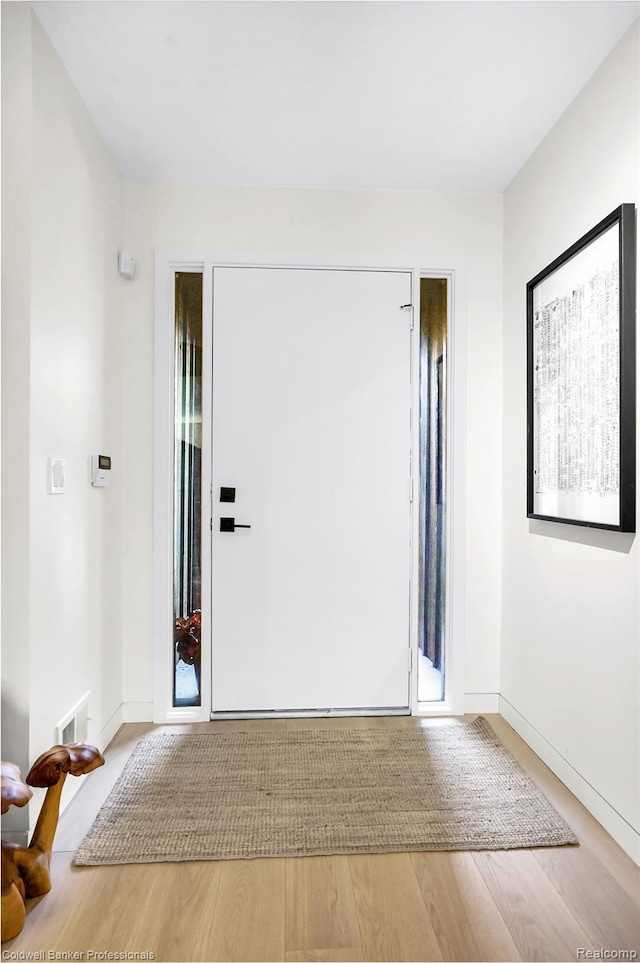 30715 River Crossing St, Bingham Farms, MI 48025 - foyer entrance with wood finished floors and baseboards