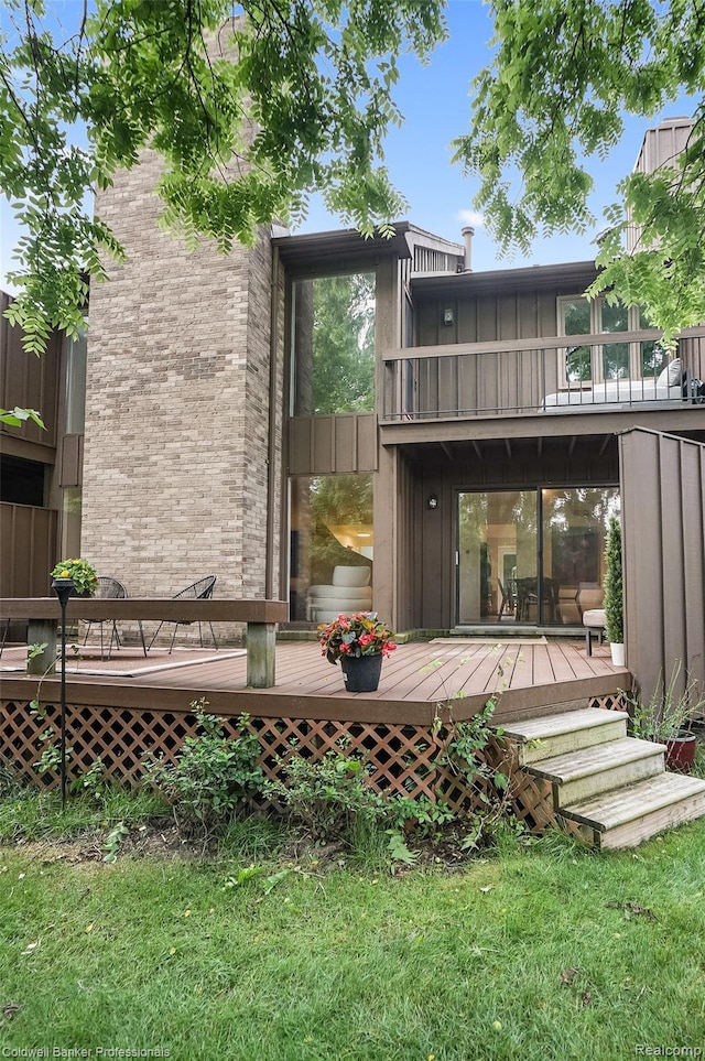 30715 River Crossing St, Bingham Farms, MI 48025 - back of house with a wooden deck, board and batten siding, and a lawn