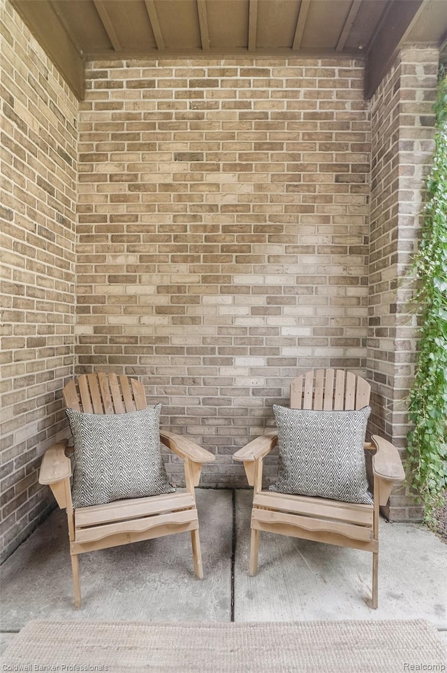 30715 River Crossing St, Bingham Farms, MI 48025 - living area featuring brick wall