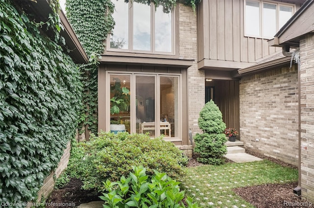 30715 River Crossing St, Bingham Farms, MI 48025 - property entrance featuring brick siding and board and batten siding