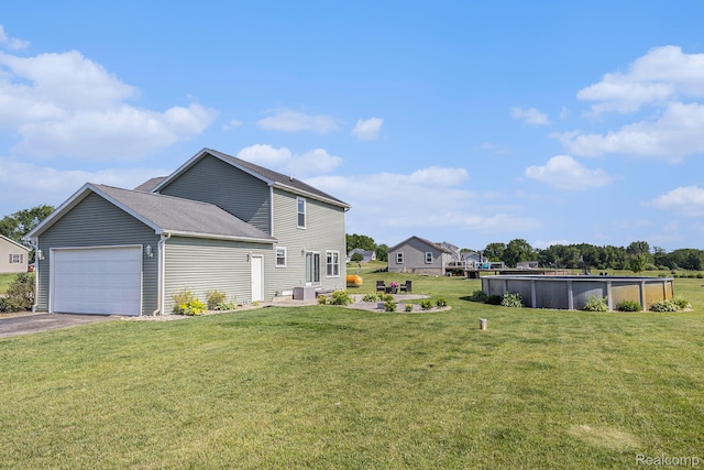 11632 Glen Mary Dr, Byron, MI 48418 - view of property exterior with a garage, a yard, asphalt driveway, and an outdoor pool