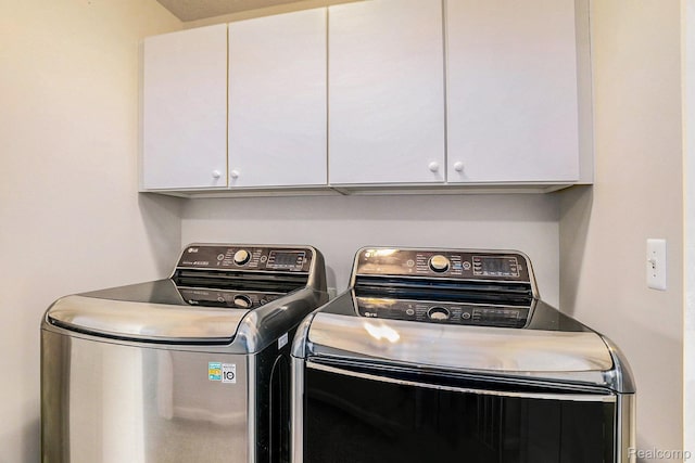 11632 Glen Mary Dr, Byron, MI 48418 - laundry room featuring washing machine and clothes dryer and cabinet space