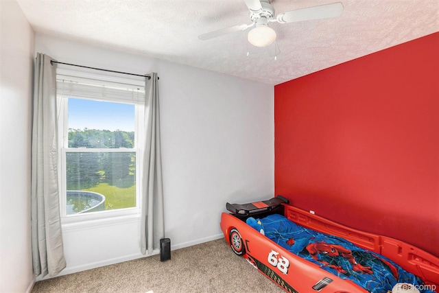 11632 Glen Mary Dr, Byron, MI 48418 - carpeted bedroom with multiple windows, a textured ceiling, and a ceiling fan