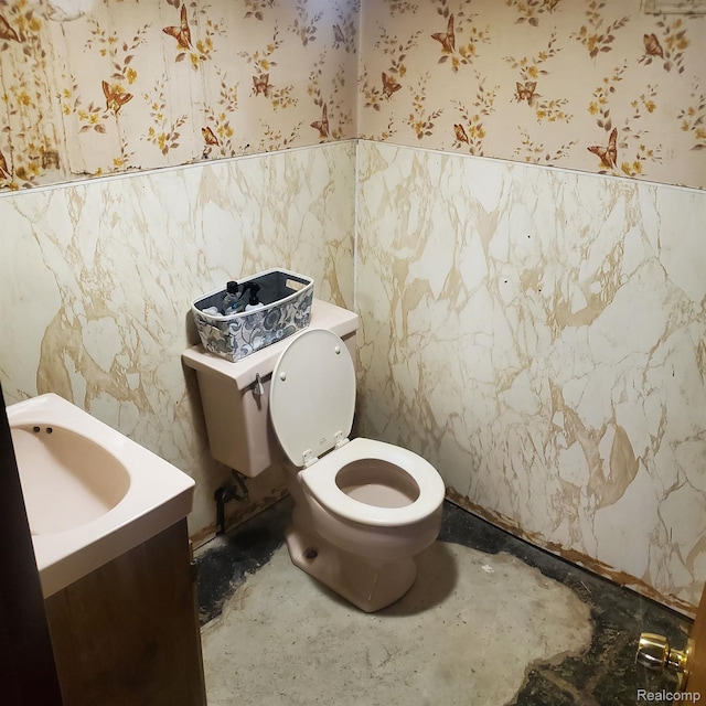 18918 Hartwell, Detroit, MI 48235 - bathroom with wallpapered walls, a wainscoted wall, vanity, and tile walls