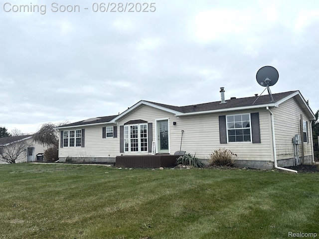 2652 Murphy Lake Rd, Silverwood, MI 48760 - back of house featuring a lawn