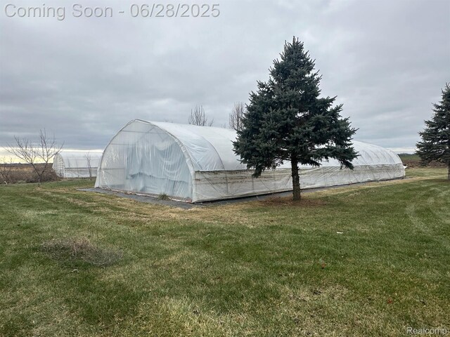2652 Murphy Lake Rd, Silverwood, MI 48760 - view of greenhouse with a yard