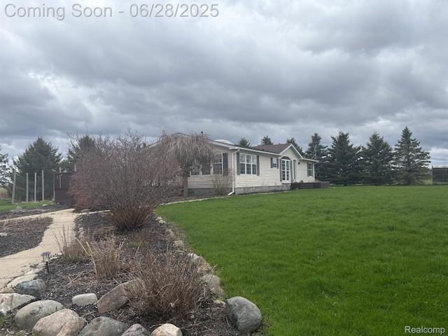 2652 Murphy Lake Rd, Silverwood, MI 48760 - view of home's exterior with a yard and crawl space
