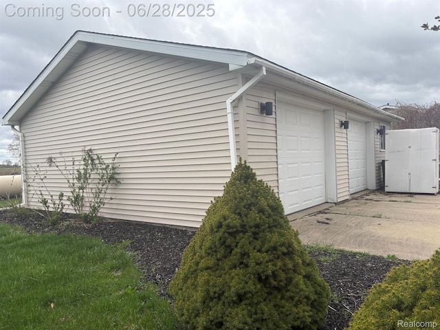 2652 Murphy Lake Rd, Silverwood, MI 48760 - view of side of property with a garage
