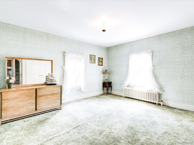 2815 Military St, Fort Gratiot, MI 48060 - bedroom featuring radiator heating unit, wallpapered walls, carpet, and multiple windows