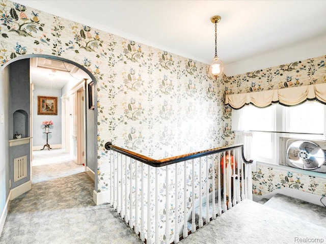 2815 Military St, Fort Gratiot, MI 48060 - corridor with wallpapered walls, carpet flooring, ornamental molding, an upstairs landing, and arched walkways
