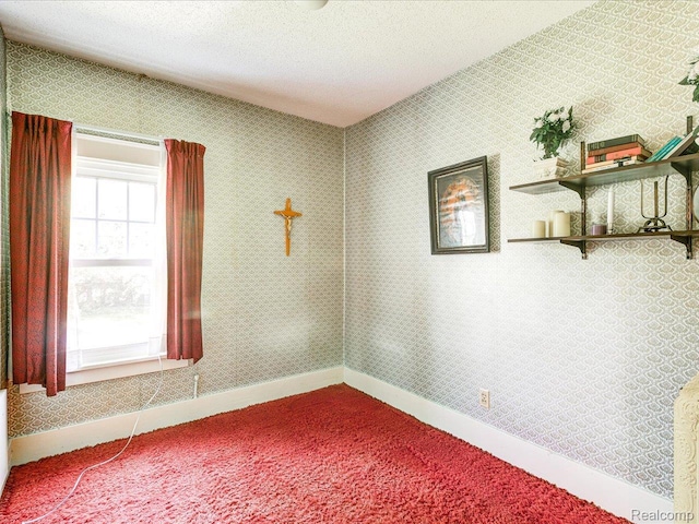 2815 Military St, Fort Gratiot, MI 48060 - carpeted empty room with baseboards and a textured ceiling