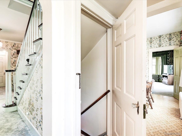 2815 Military St, Fort Gratiot, MI 48060 - corridor with wallpapered walls, stairway, and carpet floors